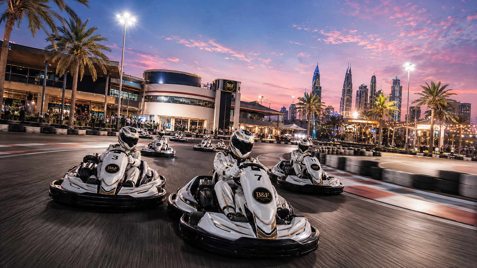 Wide evening view of the karting circuit with the Dubai skyline behind